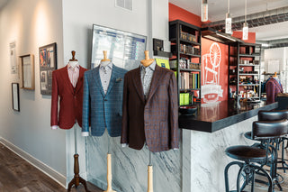 Bespoke Showroom located in Clayton, Missouri Custom Mens Suiting.  Three mannequins merchandised in pattern blazers.
